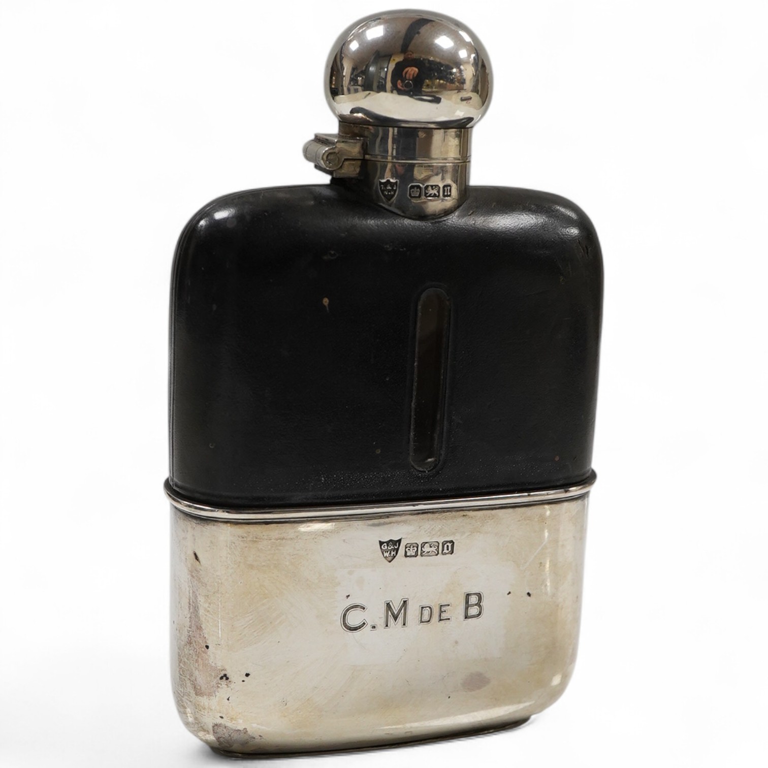 An Edwardian silver and leather mounted glass hip flask, by G & J W Hawksley, Sheffield, 1905/1906, 14.3cm, with engraved initials.